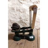 A set of cast iron scales and weights with adaptation for use in falconry