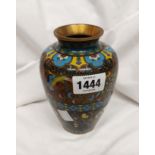 A Chinese cloisonne vase with exotic bird and floral decoration on a coloured foil ground
