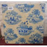 A large modern hotplate tile with blue and white transfer printed decoration depicting farmyard