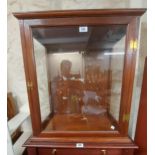 A 61cm stained mixed wood tabletop display cabinet with door to front