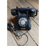 A vintage AEP black Bakelite desk telephone