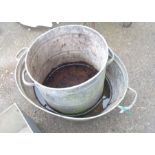 An old two handled tin bath - sold with a similar dustbin - no lids