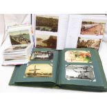 Three albums containing collections of early 20th Century and other postcards including topographic,
