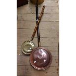 A 19th Century copper warming pan - sold with a smaller brass similar