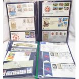 Two folders containing vintage FDCs and mint decimal stamp packs, one containing solely Bermuda