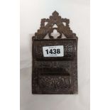 A Victorian cast iron wall mounted match holder, with lift-top compartment and strike sides - sold