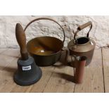 A large cast bronze school type bell with turned wood handle - sold with a Trench Art ewer made from