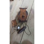 A small vintage mixed wood novelty wall timepiece in the form of an owl with moving eyes action