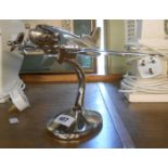 A modern metal Art Deco style desk ornament of twin propellor Aeroplane form, with polished finish