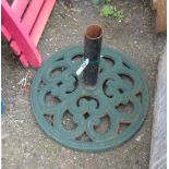 A green painted cast iron garden parasol base