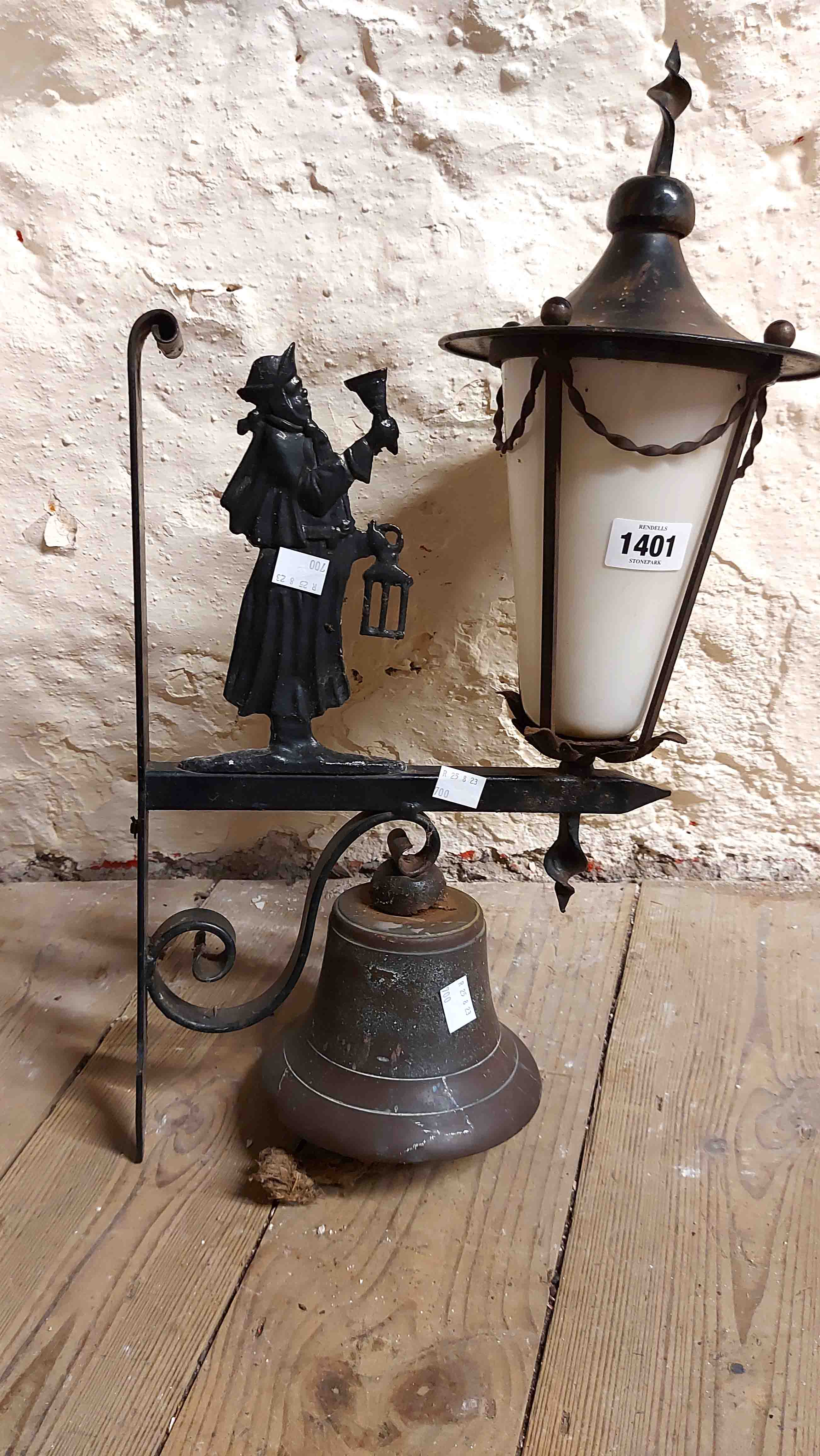 A vintage wrought and cast iron porch light with figural night watchman decoration and an opaque