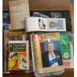 A box containing a small collection of publications, autograph album, etc.
