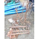 A quantity of assorted metalware including two pairs of fire dogs, companion sets, etc.