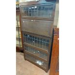 A 85cm Globe Wernicke five section modular bookcase comprising four leaded glazed bookcase sections,