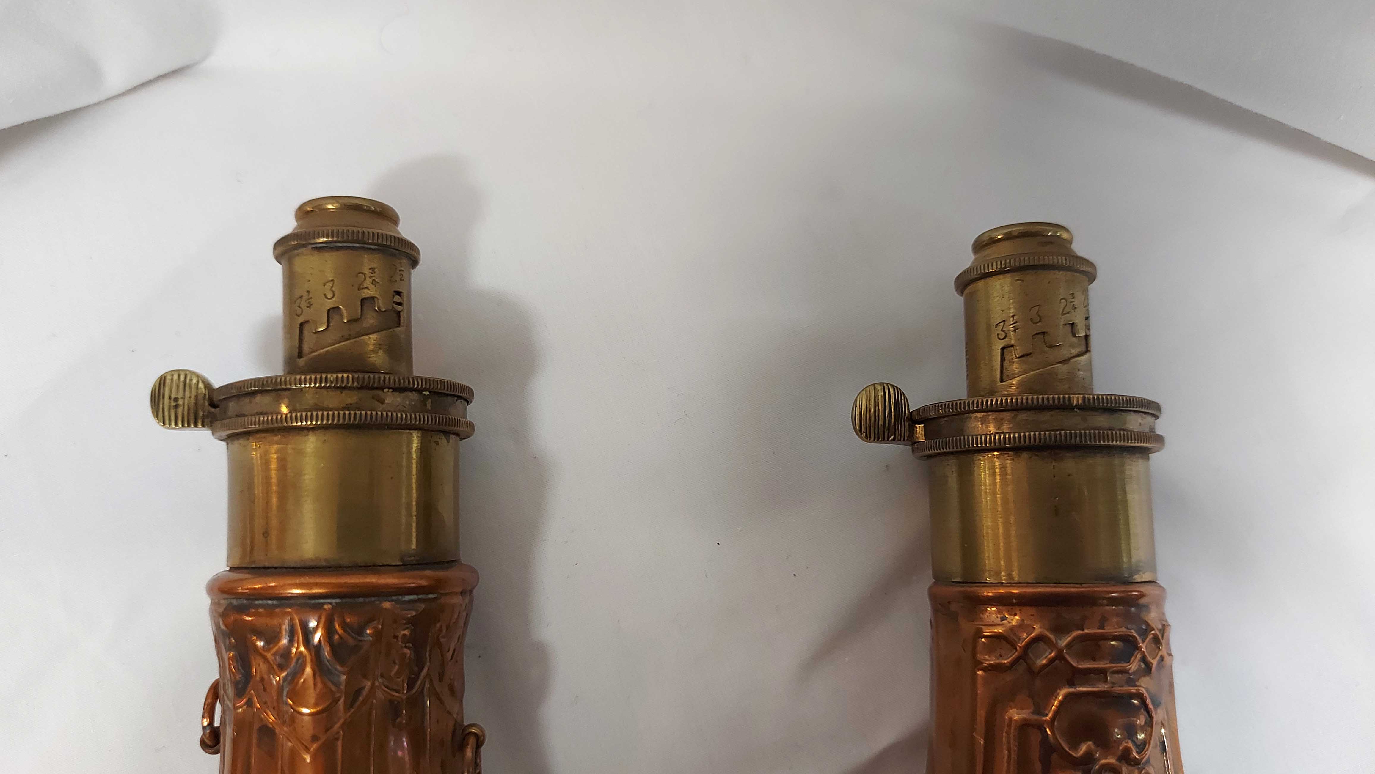 Two brass mounted copper powder flasks, each with embossed Rococo scrolling decoration - Image 2 of 3