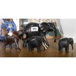 Three graduated carved ebony elephants - sold with another similar