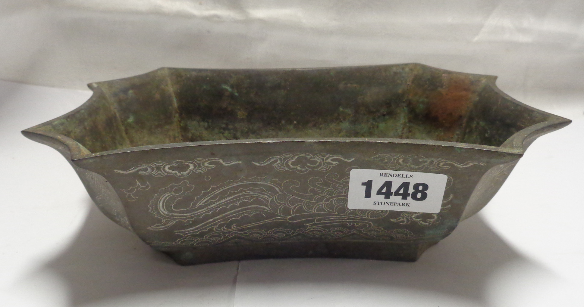 An old Chinese brass bowl with all-over chased decoration and seal mark to base