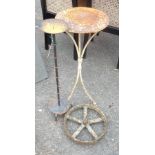 A black painted wrought iron freestanding candelabrum - sold with a similar jardiniere stand and a
