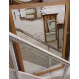 Two modern decorative bevelled oblong wall mirrors, one with parcel gilt frame, the other