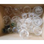 A box containing a quantity of assorted glassware including a set of four hollow stem champagnes,