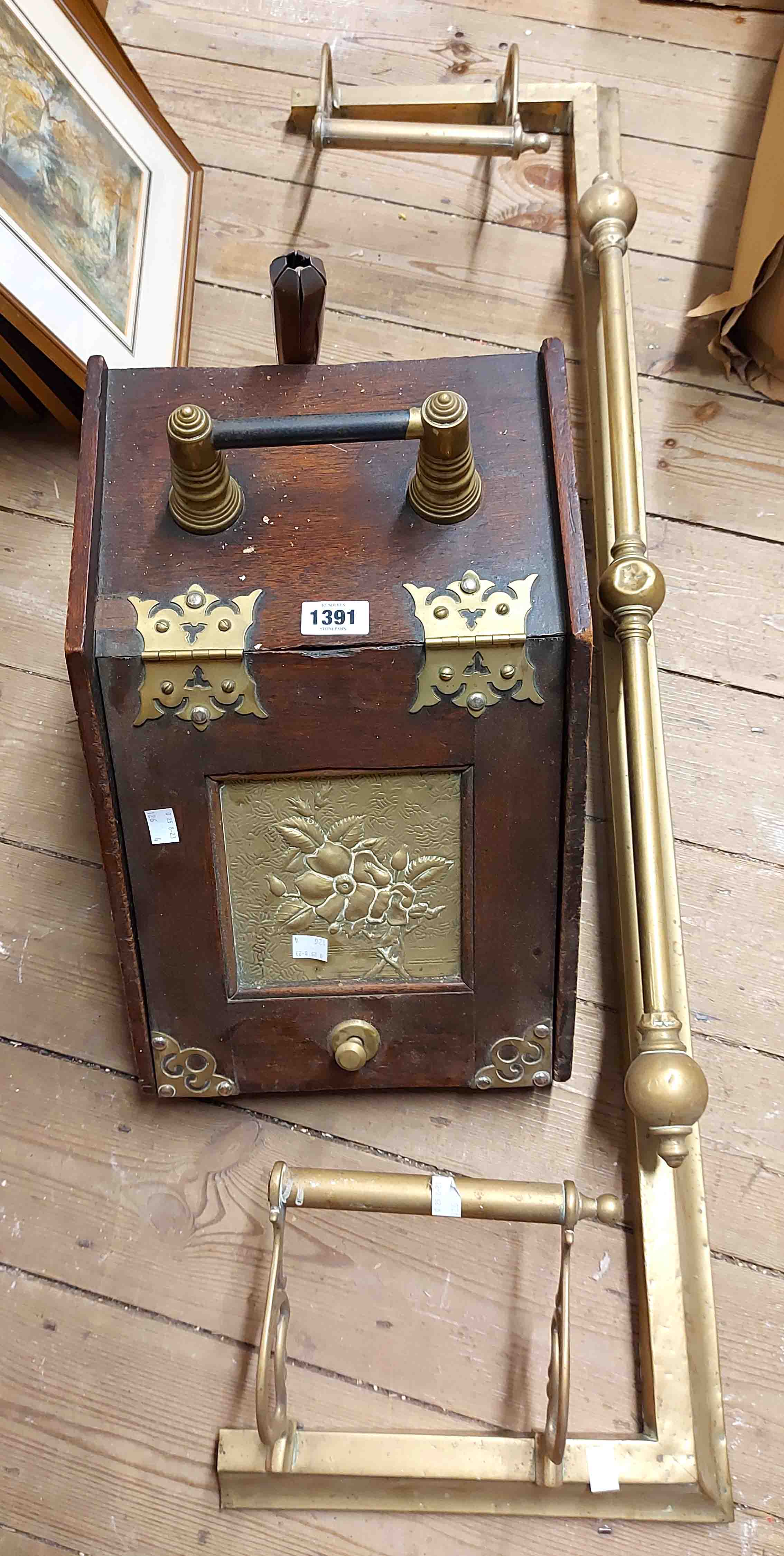 A 19th Century wooden lift-top coal box with central embossed brass panel and gothic strapwork -