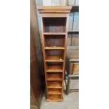 A 28cm modern Eastern hardwood CD storage unit