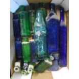 A box containing a quantity of antique bottles including green and blue poison, codd, etc.