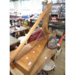 A vintage wooden harp with sound box base - in need of restringing