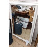 A modern white painted framed oblong wall mirror