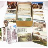A shoebox containing a quantity of early 20th Century and other postcards - mainly West Country