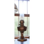 A vintage Aladdin No.21 metal oil lamp with glass chimney