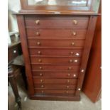 A 67cm 20th Century stained wood Wellington chest with flight of ten bracket locking drawers, set on