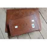 An old lift-top box with two internal compartments and initials to lid - sold with an old leather