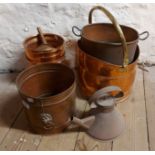 A quantity of copper and brass items including jardinieres, kettle, coal scuttle, etc.