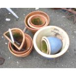 A quantity of assorted terracotta and other plant pots