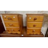 A pair of modern pine three drawer bedside chests