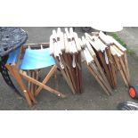 A set of six blonde wood framed director's style elbow chairs with slung canvas upholstery - sold