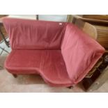 A 1.1m vintage corner seat with red velour upholstery