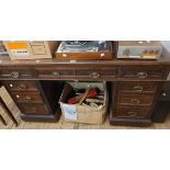 A 1.37m late Victorian mahogany twin pedestal desk with leather inset top, three frieze drawers