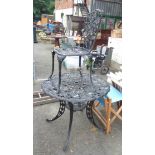 A black painted cast aluminium circular garden table in the antique style - sold with a chair to