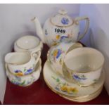 A Royal Doulton bone china tea for two tea set with transfer printed floral decoration comprising