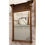 An antique Georgian style gilt framed pier mirror with beading and diaper ground panel to top,