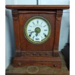 An antique oak cased shelf clock with dial marked for Fattorini & Sons, Bradford, with American