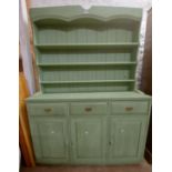 A 1.37m 20th Century green painted pine two part dresser with three shelf open plate rack over a