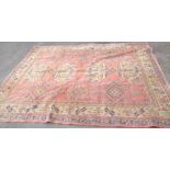 A vintage handmade wool Hamadan pattern carpet with four central medallions and further flanking