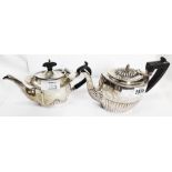 A small silver teapot of semi-reeded oval design - sold with another - both a/f