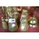 Five cast brass figural table bells including cat, crinoline lady. and other examples - sold with