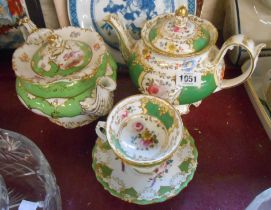 A mid 19th Century bone china teapot with hand painted floral sprays within a green panel ground and