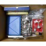 A box containing a quantity of silver plated items including toast rack, cased and loose cutlery -