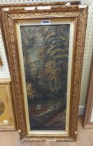 A pair of old gilt framed oils on board in narrow portrait format, one depicting a woodland river,